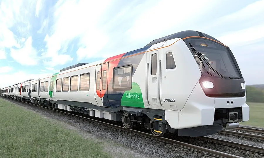 Metro train carriages beside railway tracks
