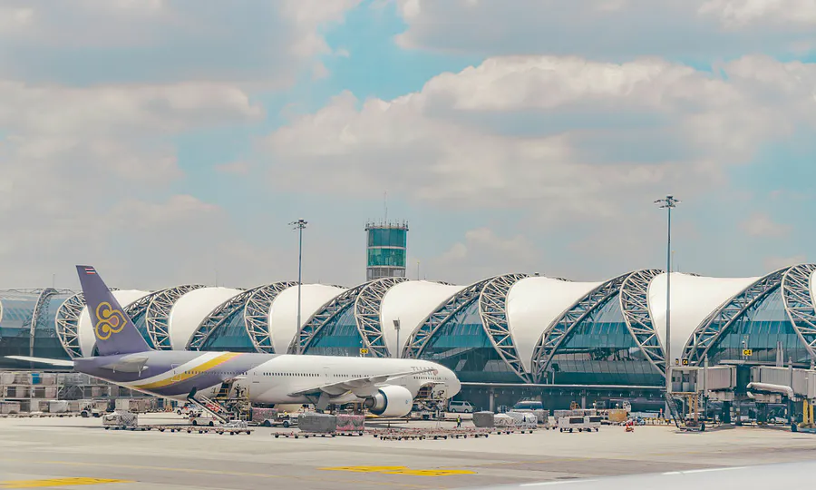 Passenger aircraft parked at an airport terminal in Thailand