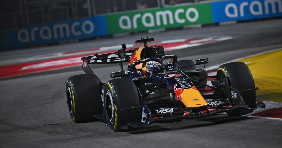 Formula 1 cars on an illuminated street circuit