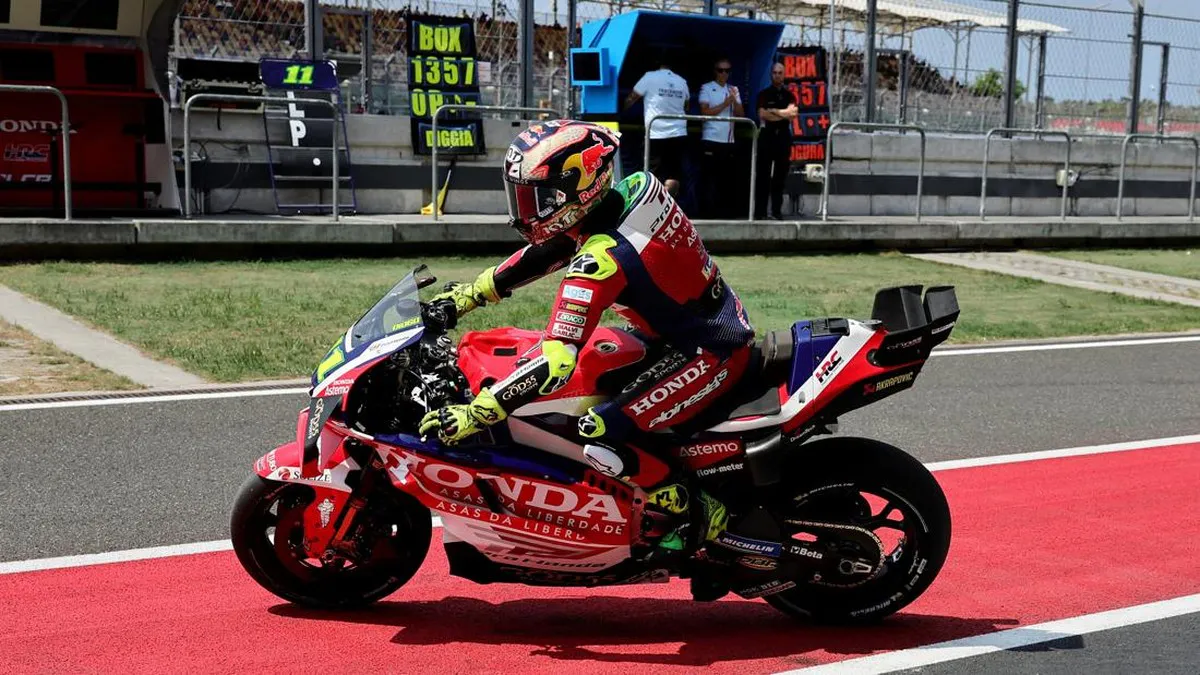 Motorcycle racing circuit with kerbs and a pit lane
