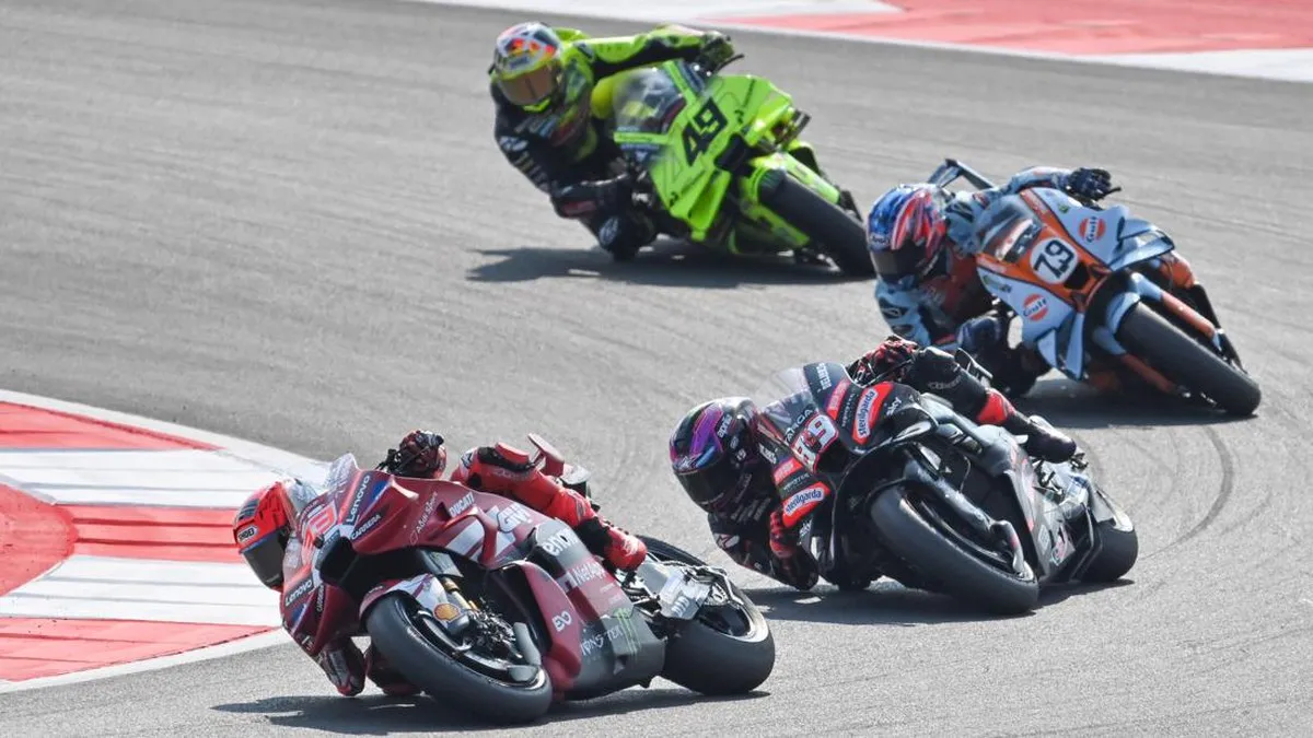 Motorcycles racing around a bend on a circuit