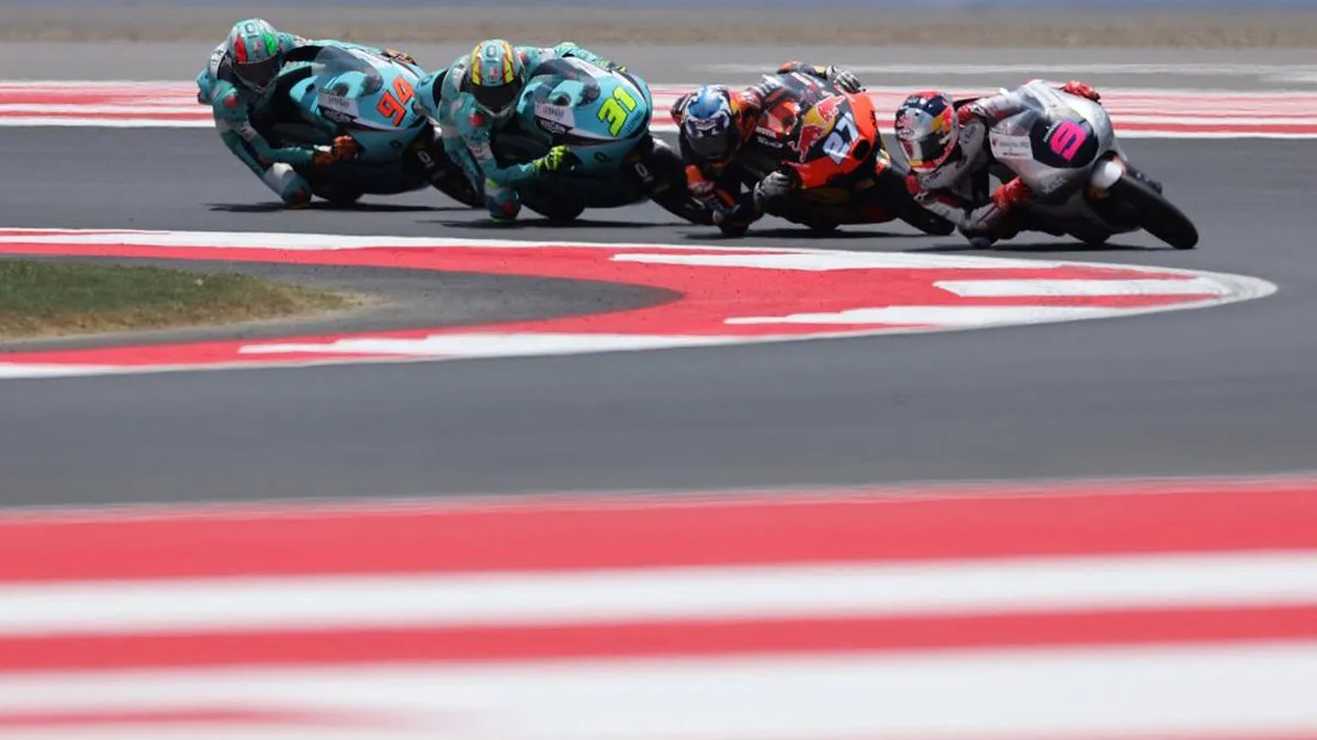 Motorcycle racing circuit with kerbs and a trackside grandstand