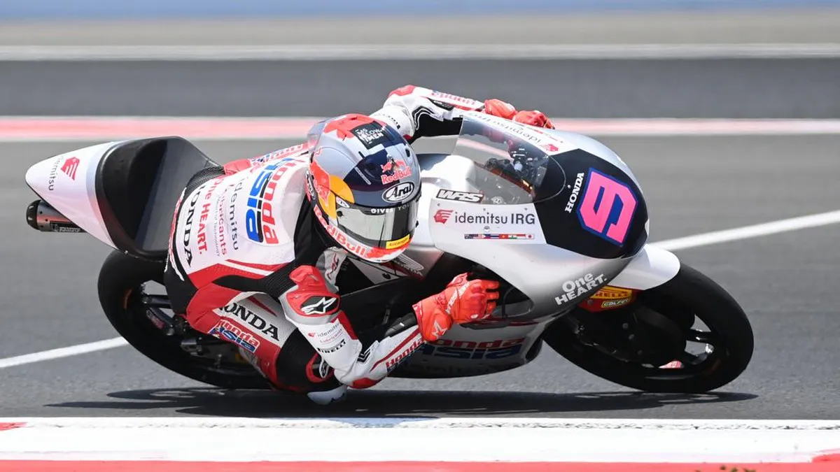 Motorcycle racing circuit with kerbs and a paved track