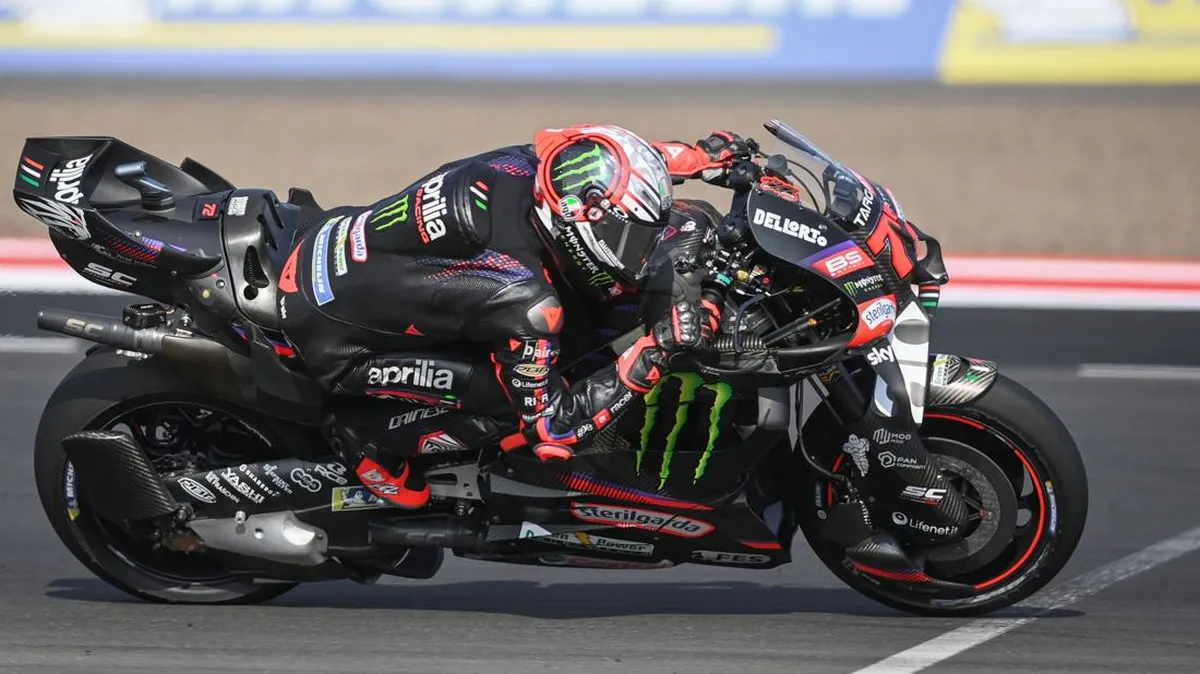 Motorcycle racing circuit with kerbs and grandstands