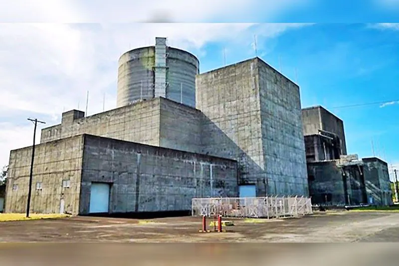 Exterior of a power generation facility with transmission lines