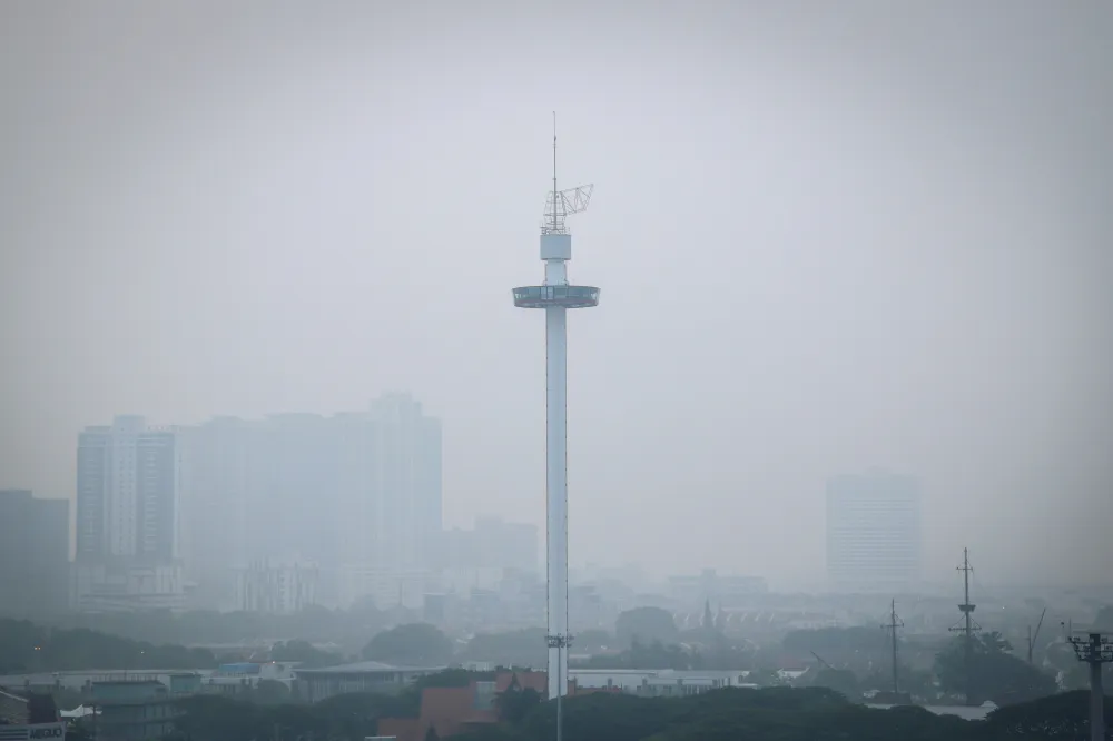 City buildings partly obscured by haze