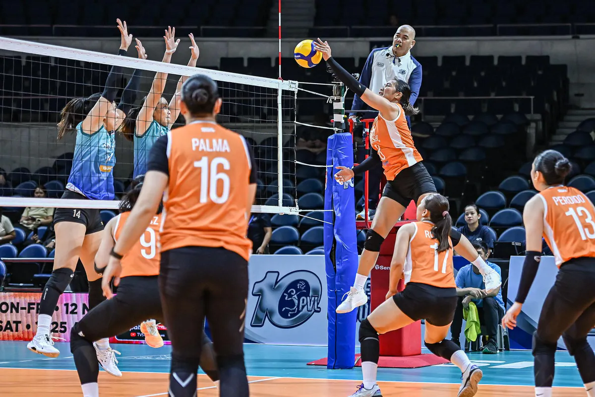 Volleyball and net on an indoor court