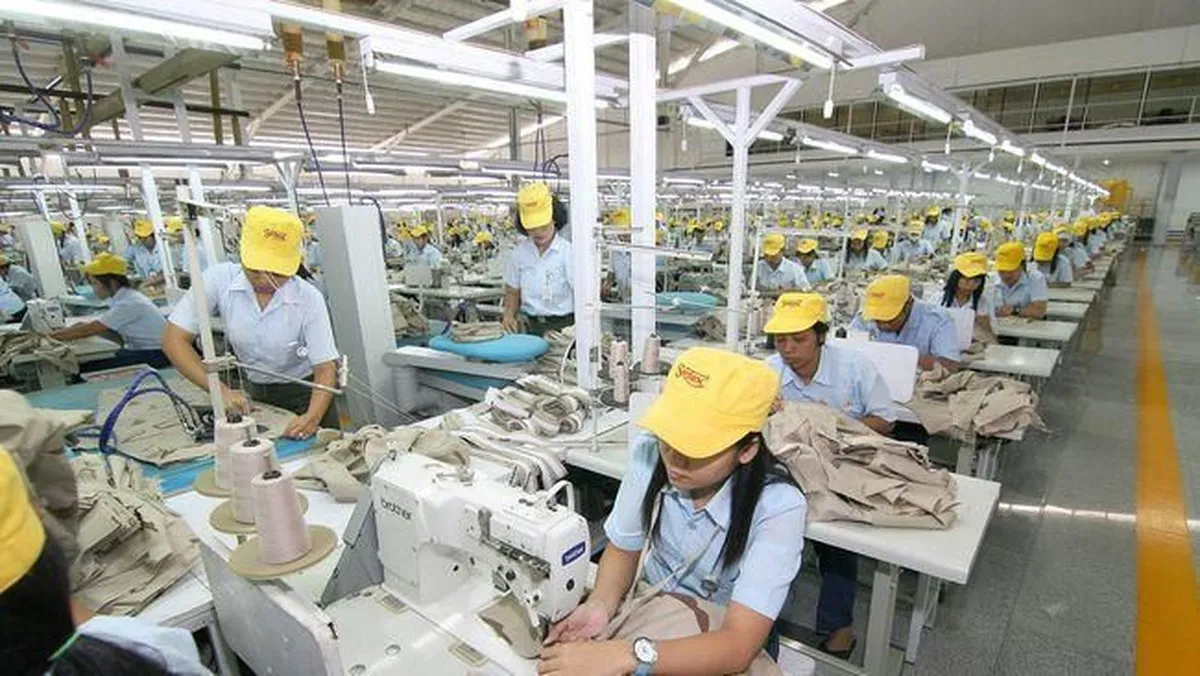 Textile machinery and rolls of fabric inside a factory