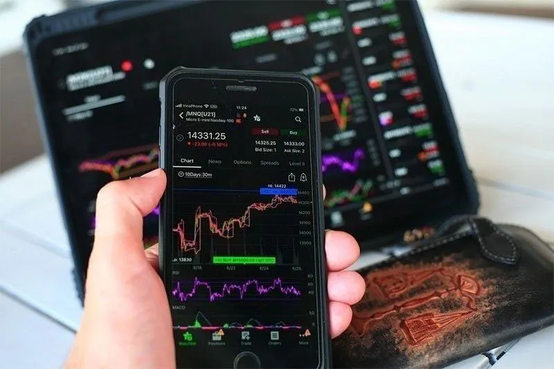 Stock market price board displaying share movements