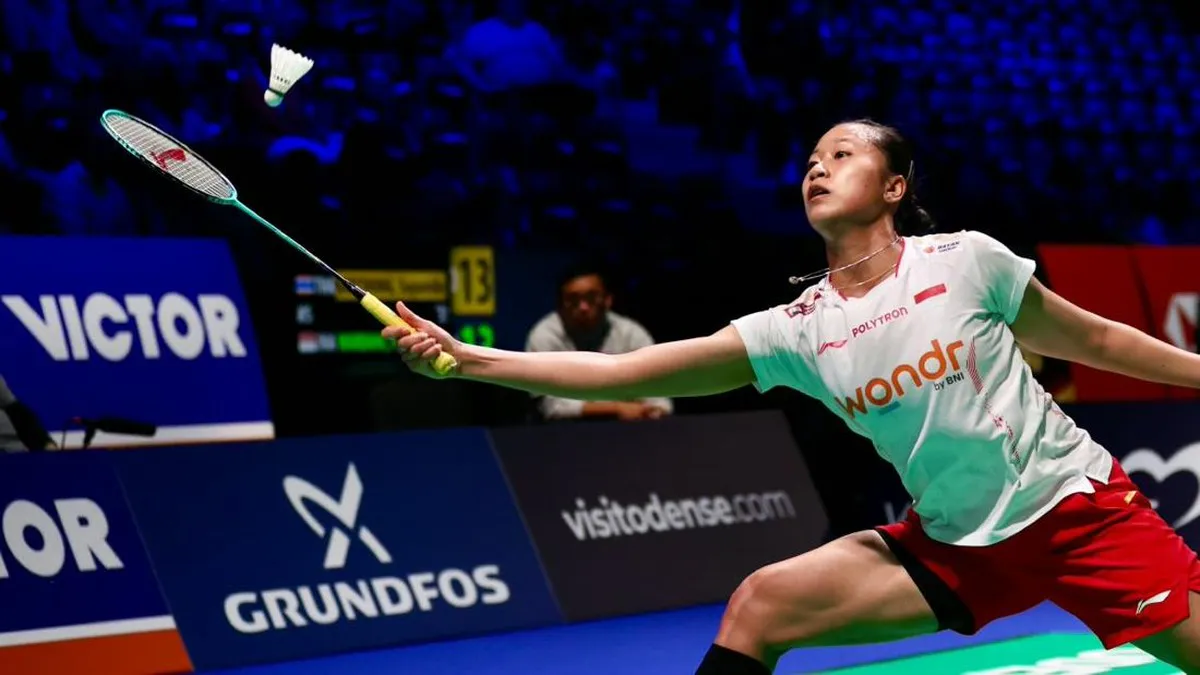 Badminton racket and shuttlecock on an indoor court