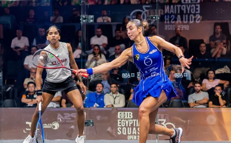 Squash racket and ball on an indoor court