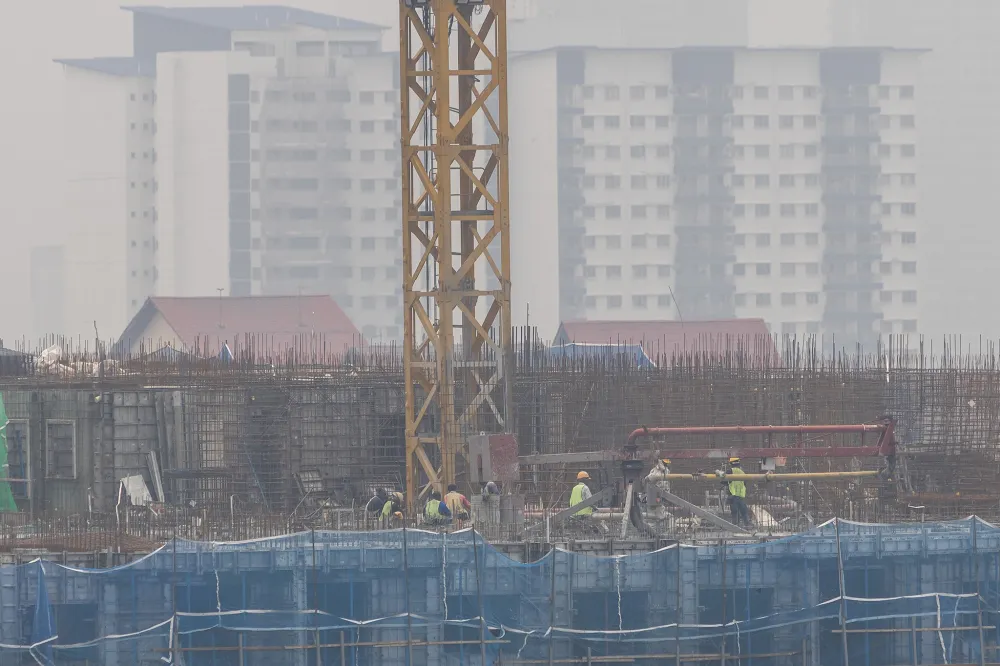 Haze obscuring buildings along an urban skyline