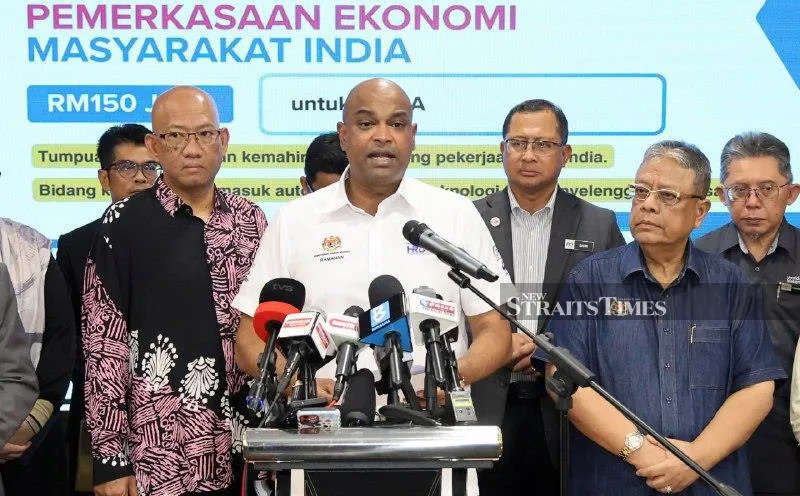Malaysian ringgit banknotes beside a calculator
