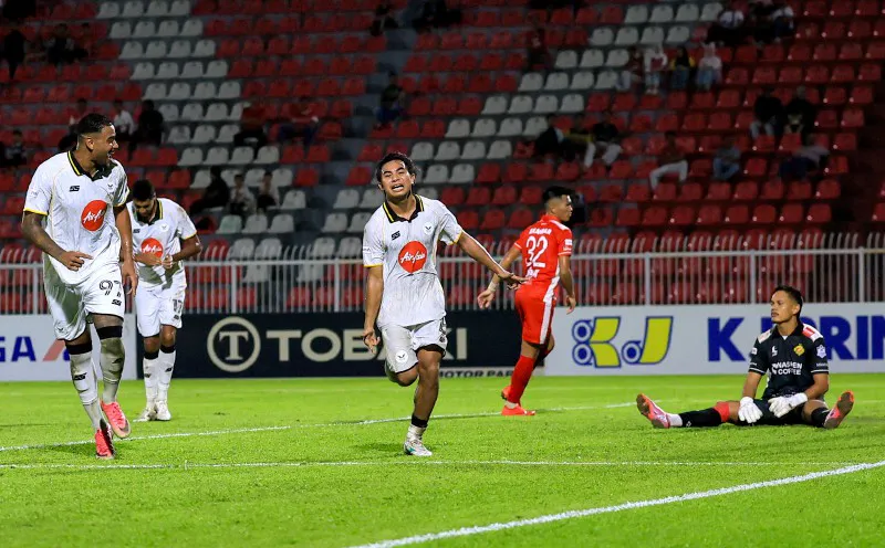 Football on the grass beside a marked touchline