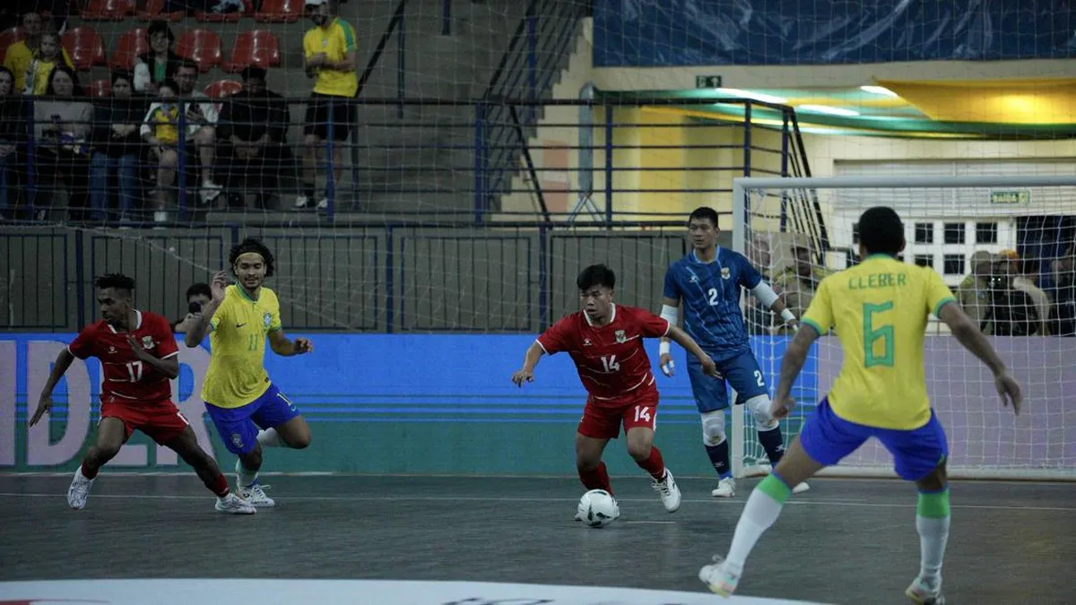 Futsal ball on an indoor court near a goal