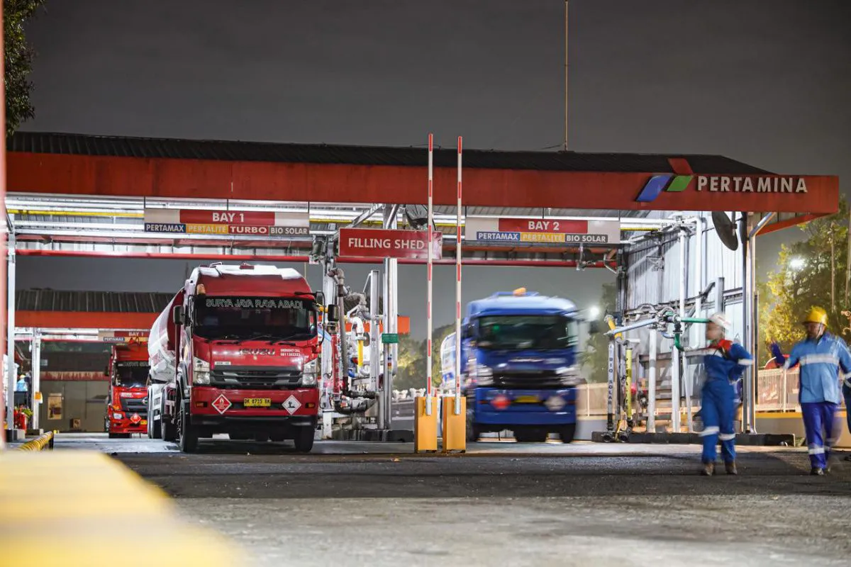 Fuel pumps and a tanker at a petrol station