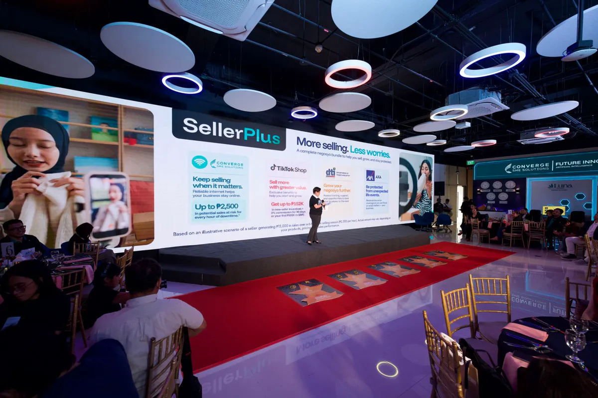A broadband router beside a smartphone and products arranged for online selling