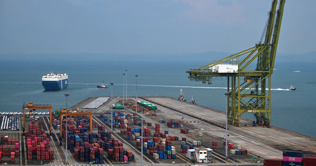 Shipping containers and cranes at a container terminal