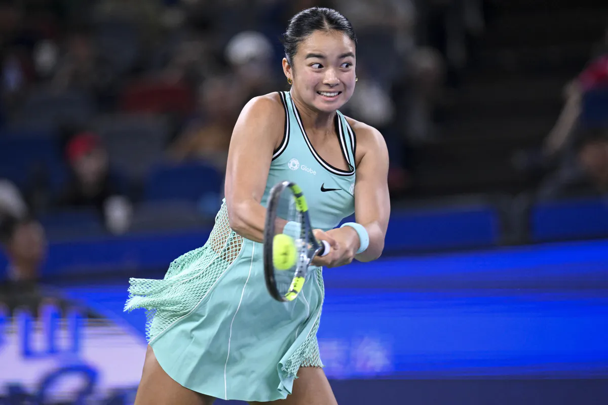 Tennis racquet and balls on a hard court