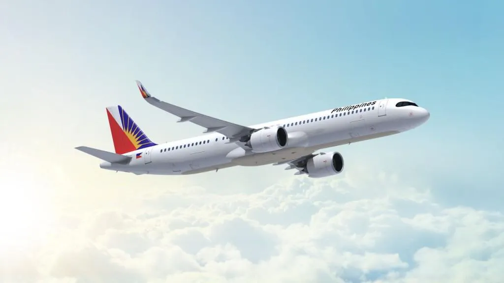 Passenger aircraft parked beside an airport terminal