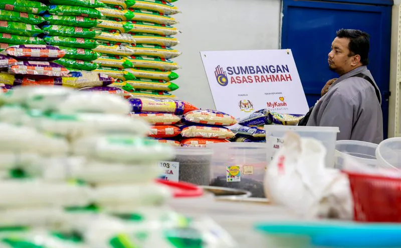 Rice, cooking oil and eggs on a supermarket shelf