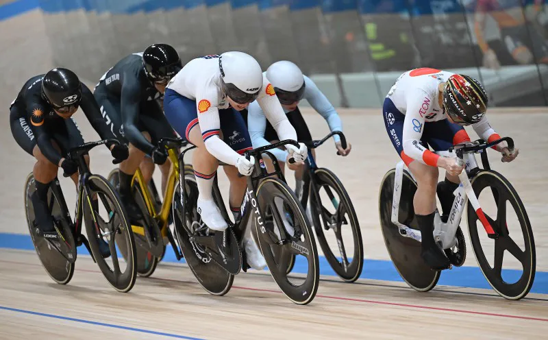 Track cycling bicycles on the banked surface of an indoor velodrome