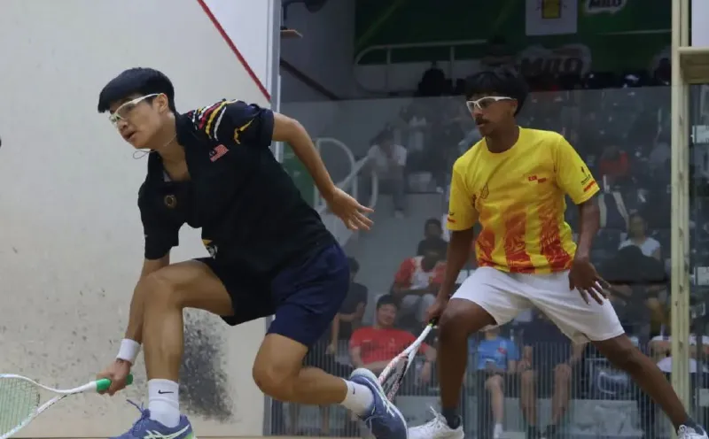 Squash racket and ball on an indoor court