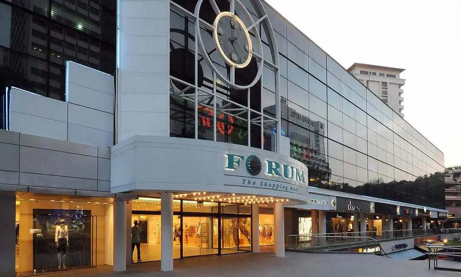 Hotel and retail buildings along a Singapore shopping street