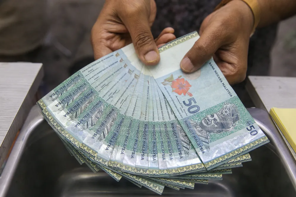 Malaysian ringgit banknotes arranged on a table