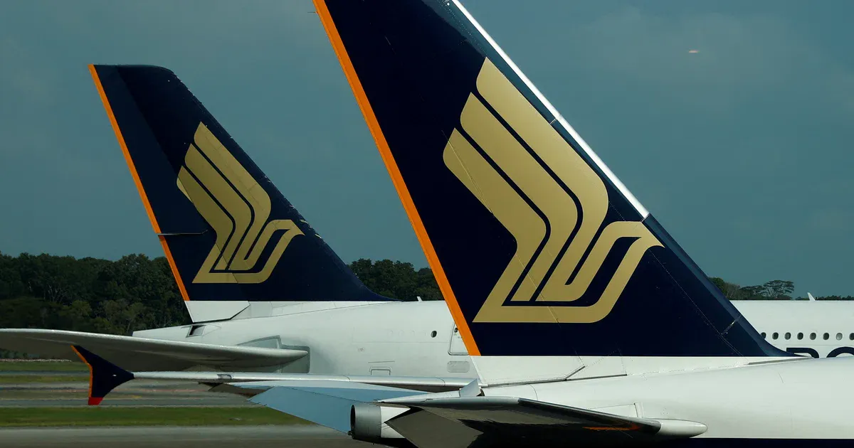 Aircraft parked beside an airport terminal