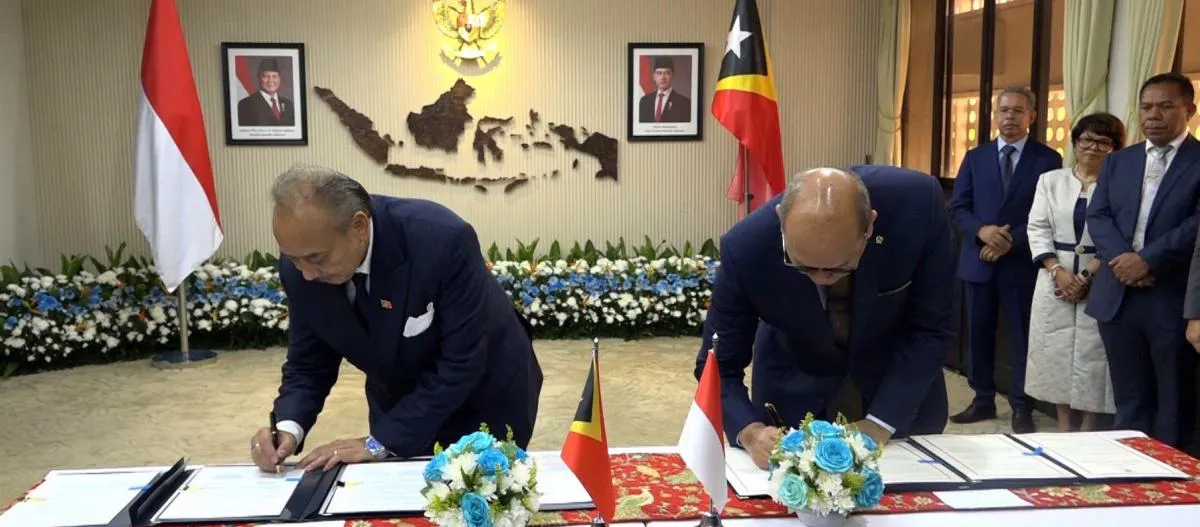 Flags of Timor-Leste and Indonesia displayed side by side