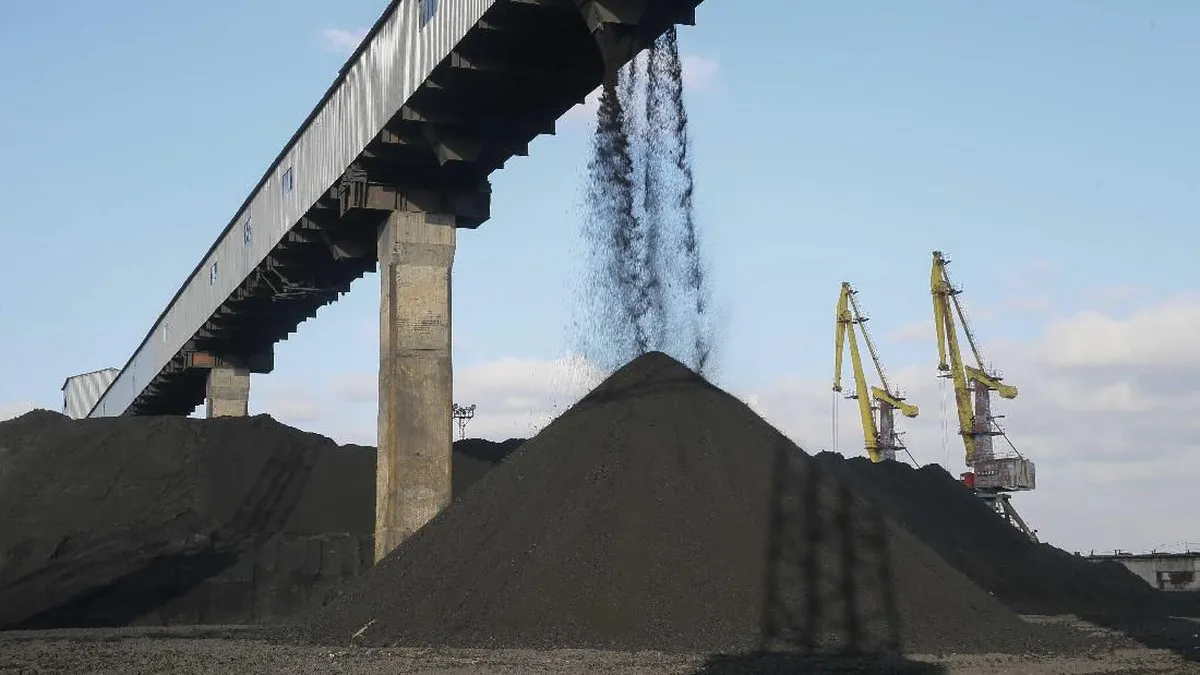 Coal stockpiles at an industrial storage site
