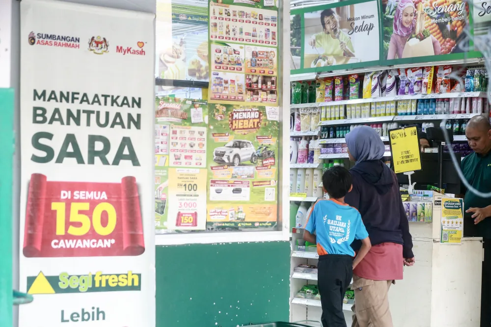 Malaysian ringgit banknotes beside a shopping basket