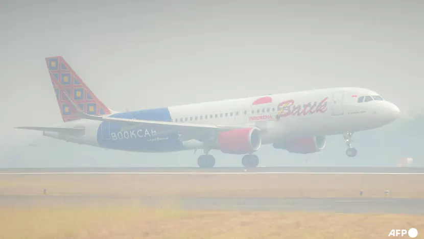 Aircraft on an airport apron in hazy conditions