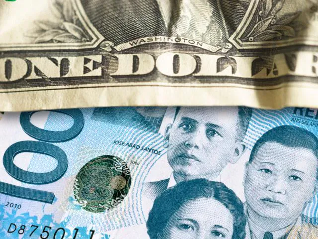 Philippine peso banknotes beside US dollar banknotes