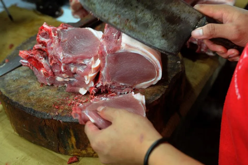 Pork cuts displayed at a meat counter