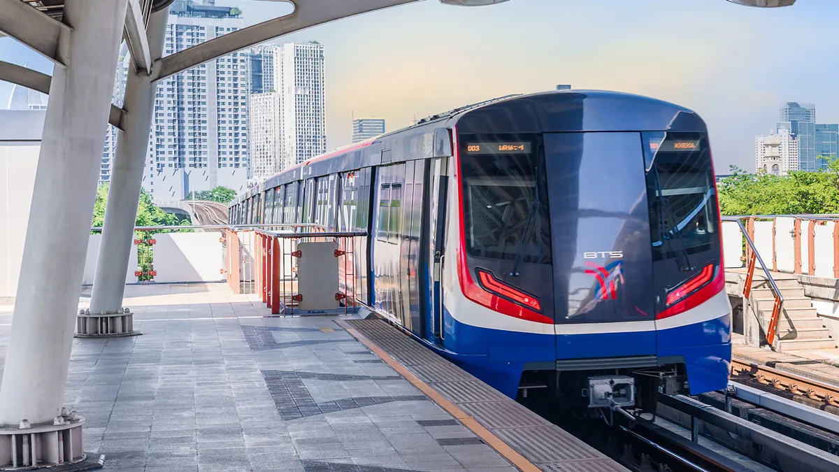 Electric passenger train at an elevated urban rail station