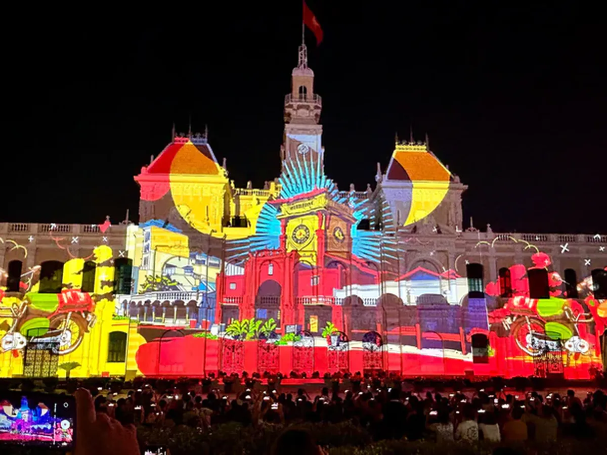 Illustration of colourful light projections on a civic building at night