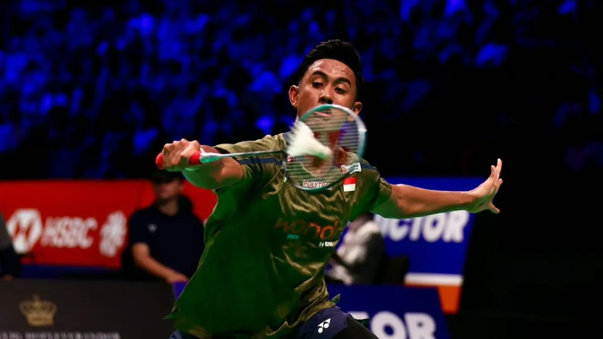 Badminton racket and shuttlecock on an indoor court