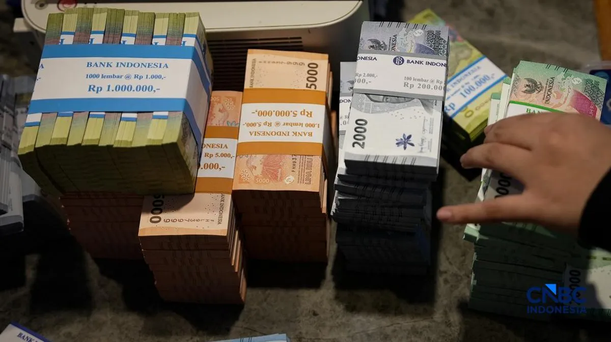 Indonesian rupiah banknotes arranged on a table