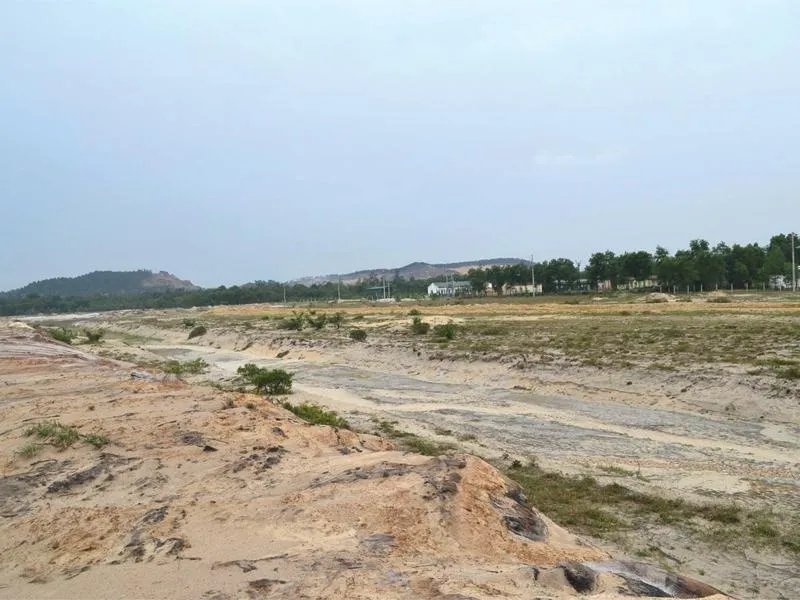 Iron ore and earth-moving equipment at a mining site