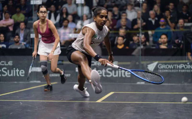 Squash racquet and ball on an indoor court