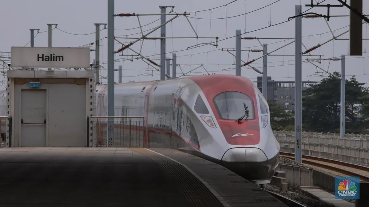 High-speed passenger train beside a railway platform