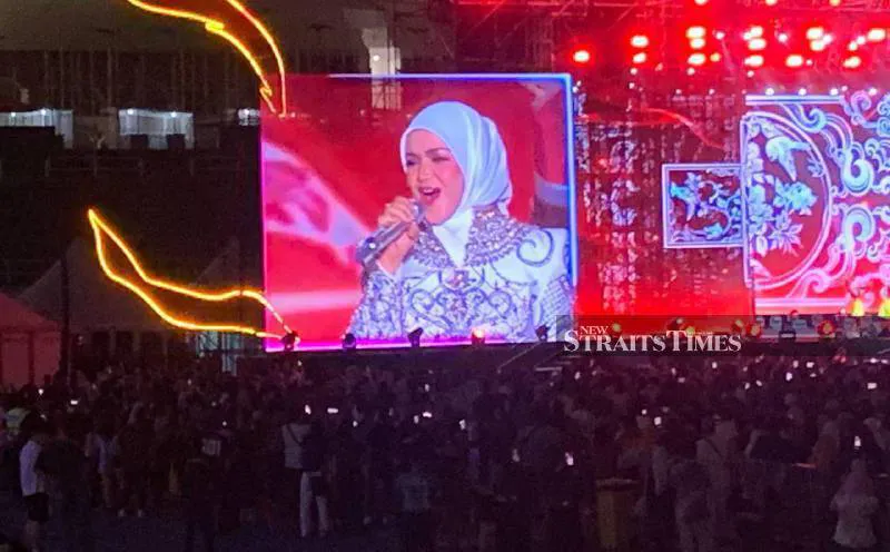 Concert stage with microphones and lighting in a stadium