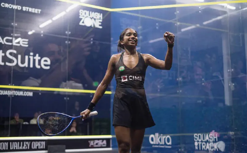 Squash racquet and ball on an indoor court