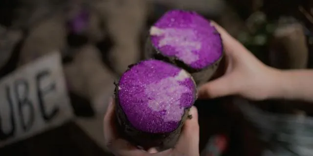 Purple yams displayed at an agricultural market