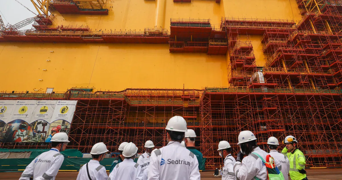 Offshore drilling rigs at a shipyard