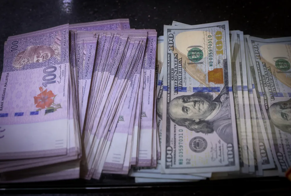 Malaysian ringgit and US dollar banknotes