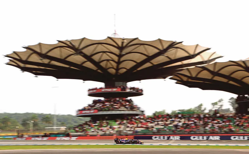 A motor racing circuit with grandstands and pit buildings