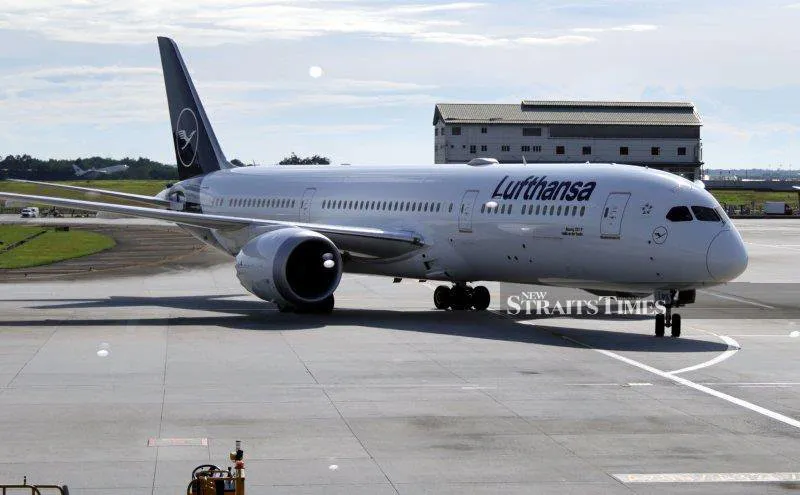 Passenger aircraft parked beside an airport terminal